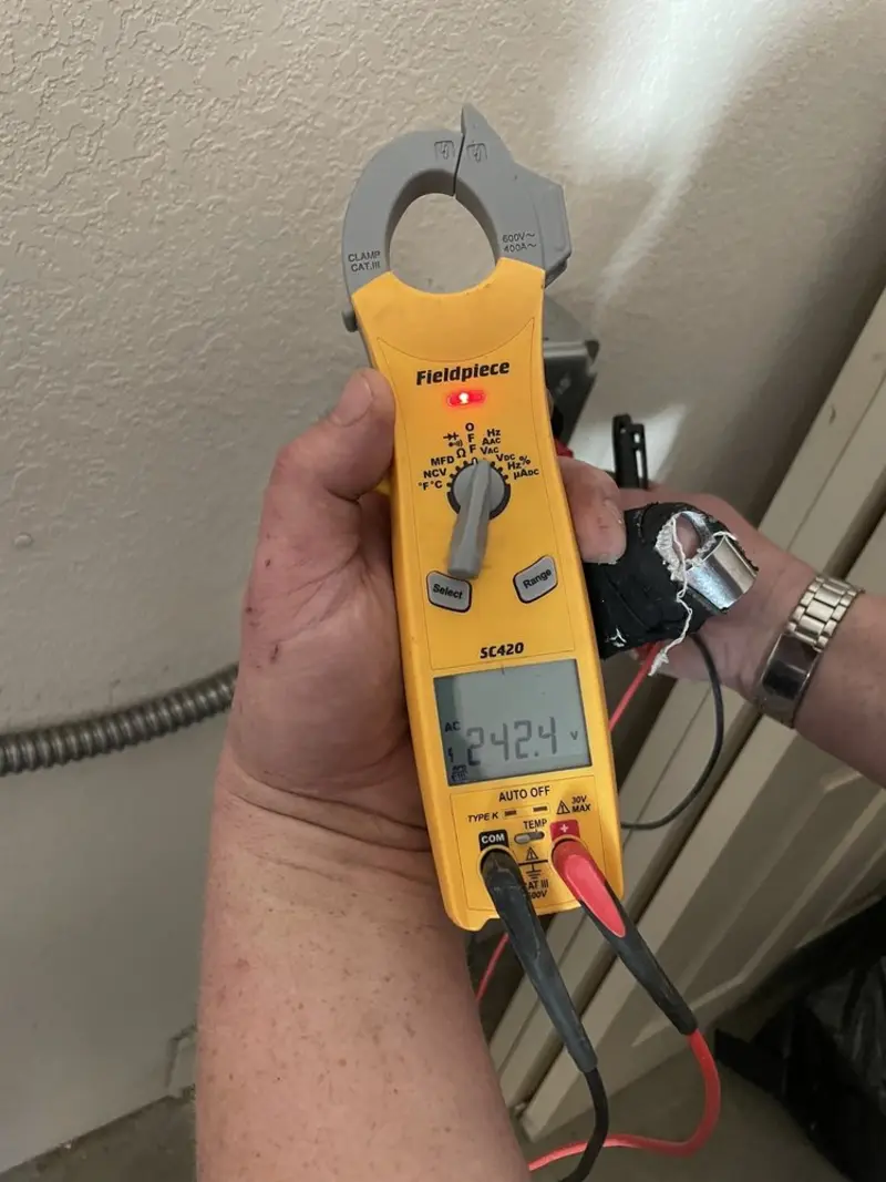 Voltage testing with clamp meter during Outlet Installation in Corcoran